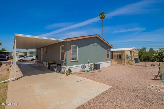 a swimming pool with outdoor seating and yard