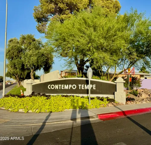 a view of outdoor space with signage and flags