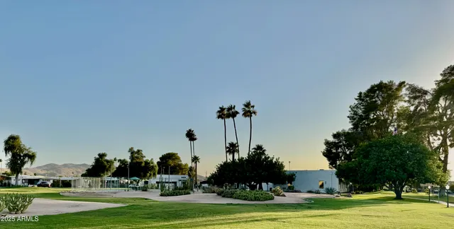 a view of a patio with table and chairs