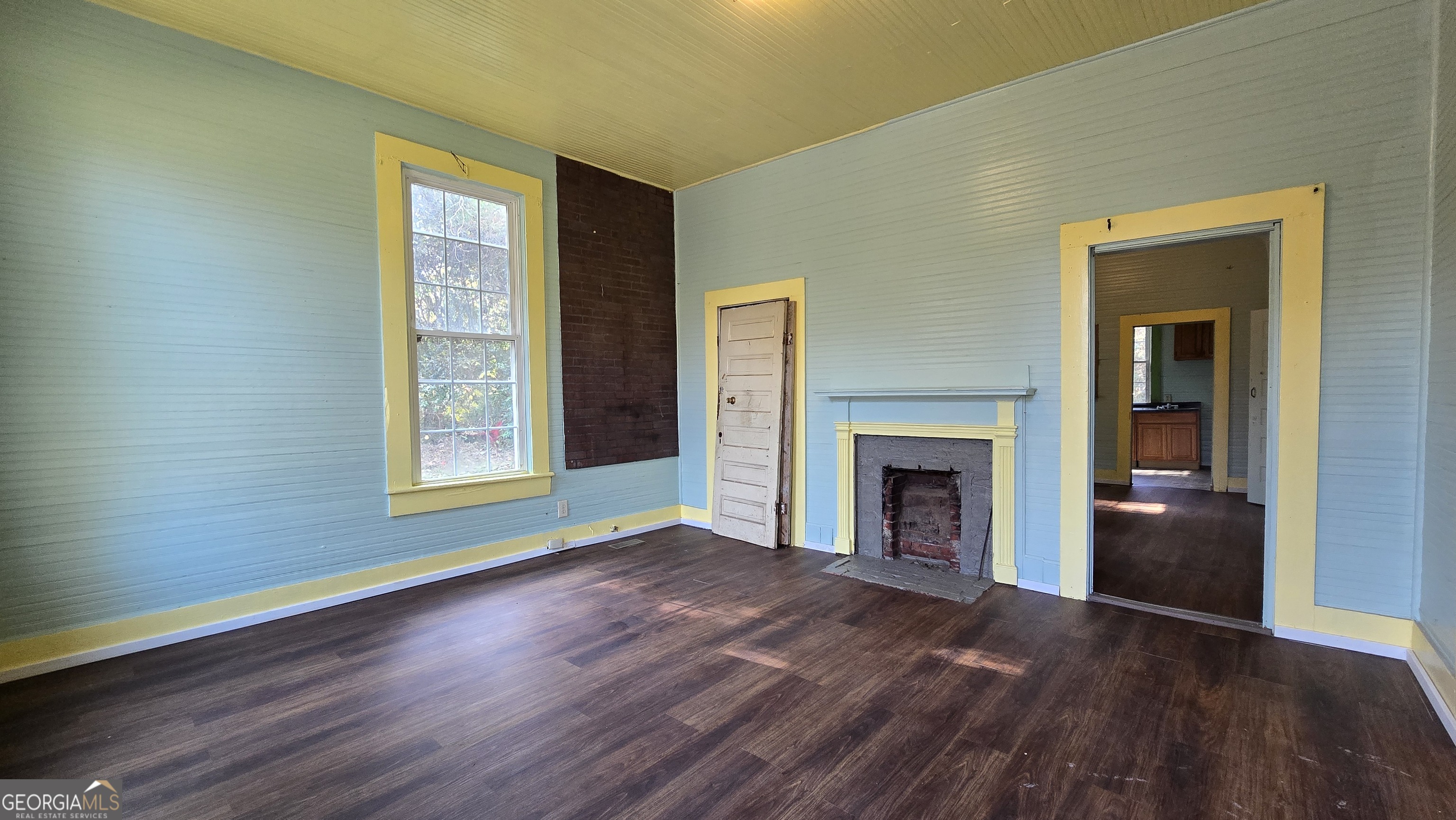 509 Anderson Avenue Fort Valley, GA 31030 - Photo 14 of 22 a view of an empty room with window and fire place