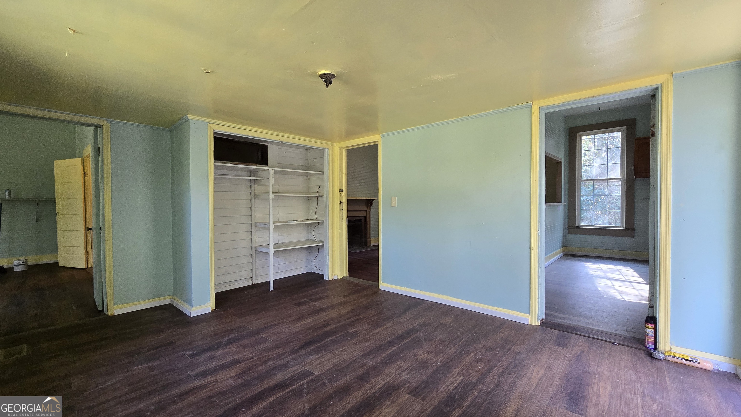509 Anderson Avenue Fort Valley, GA 31030 - Photo 16 of 22 an empty room with wooden floor and closet