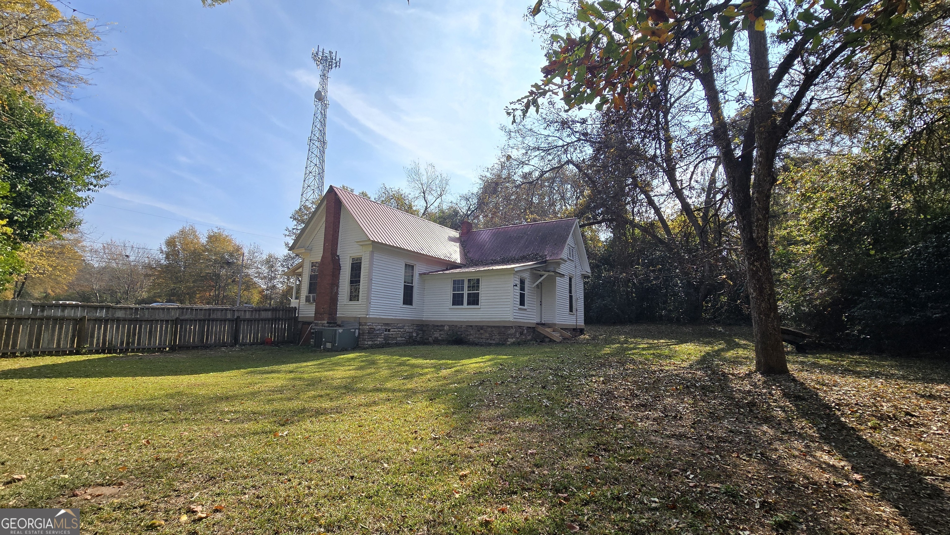 509 Anderson Avenue Fort Valley, GA 31030 - Photo 17 of 22 a view of a house with a large tree and a big yard