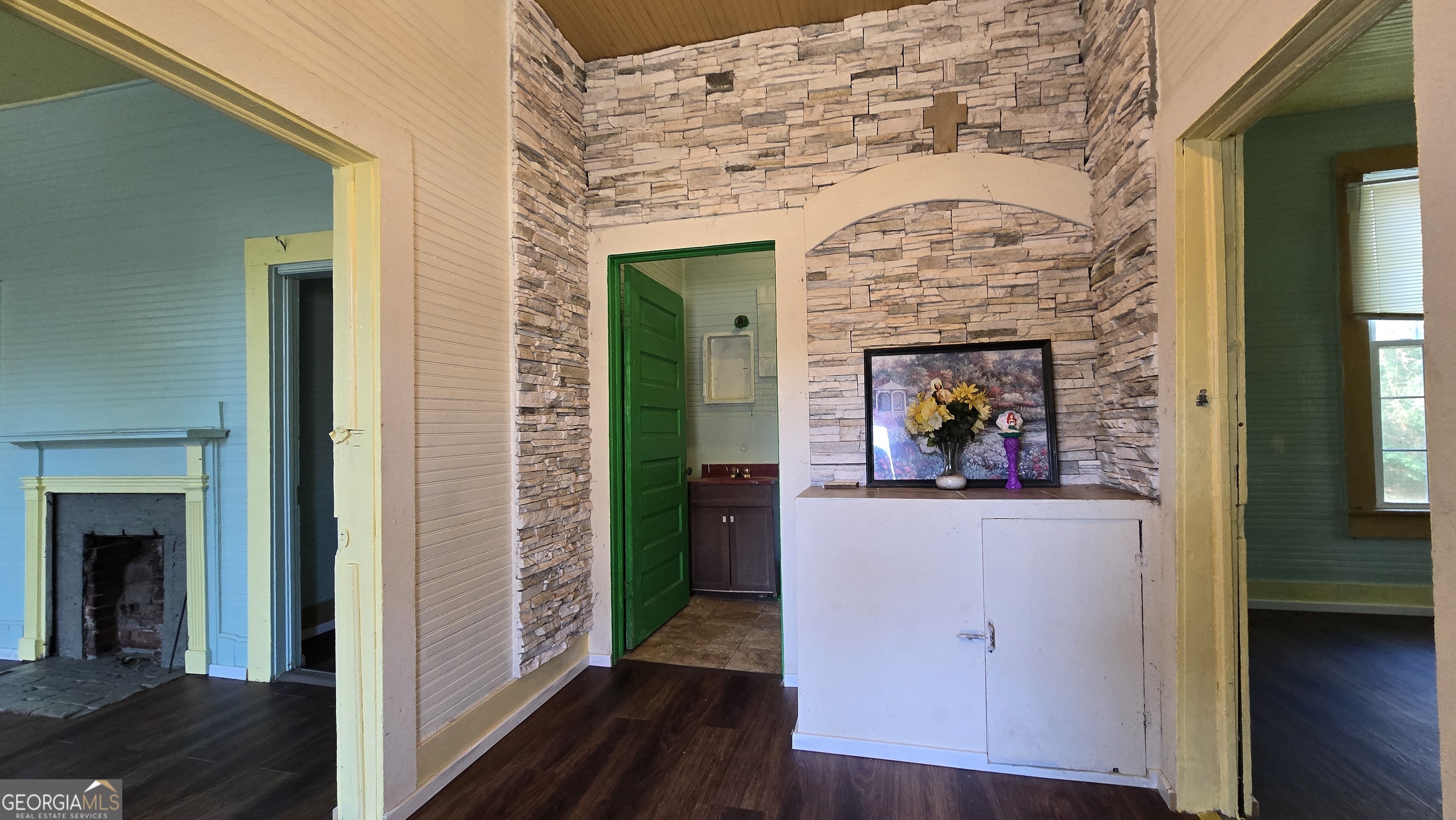 509 Anderson Avenue Fort Valley, GA 31030 - Photo 5 of 22 a view of living room with wooden floor and a fireplace