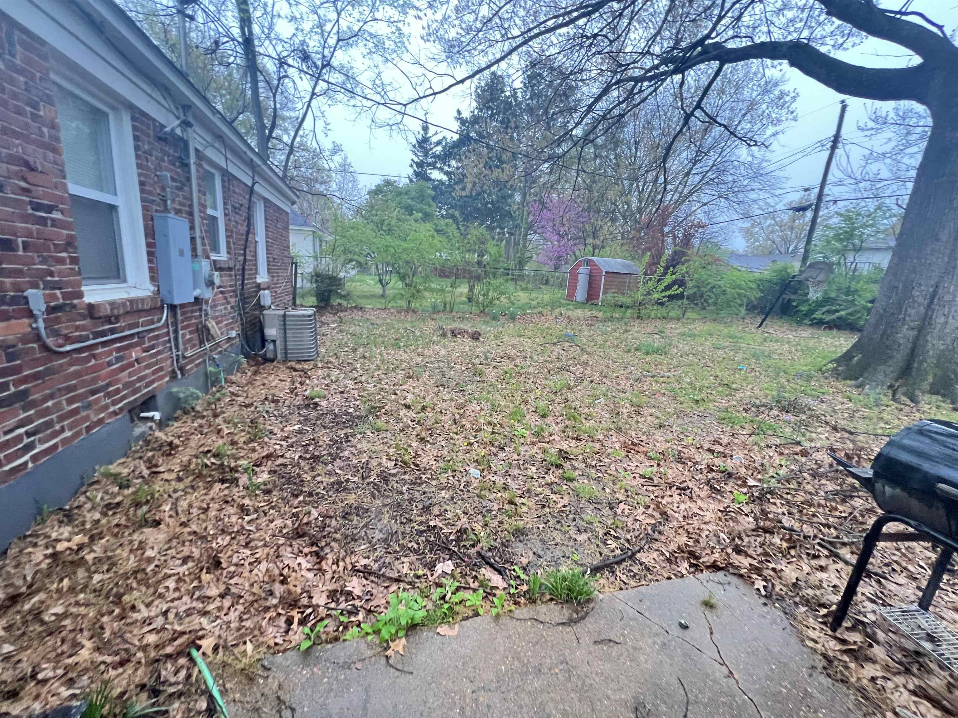 1007 Railton Road Memphis, TN 38111 - Photo 11 of 12 a view of a yard covered with trees