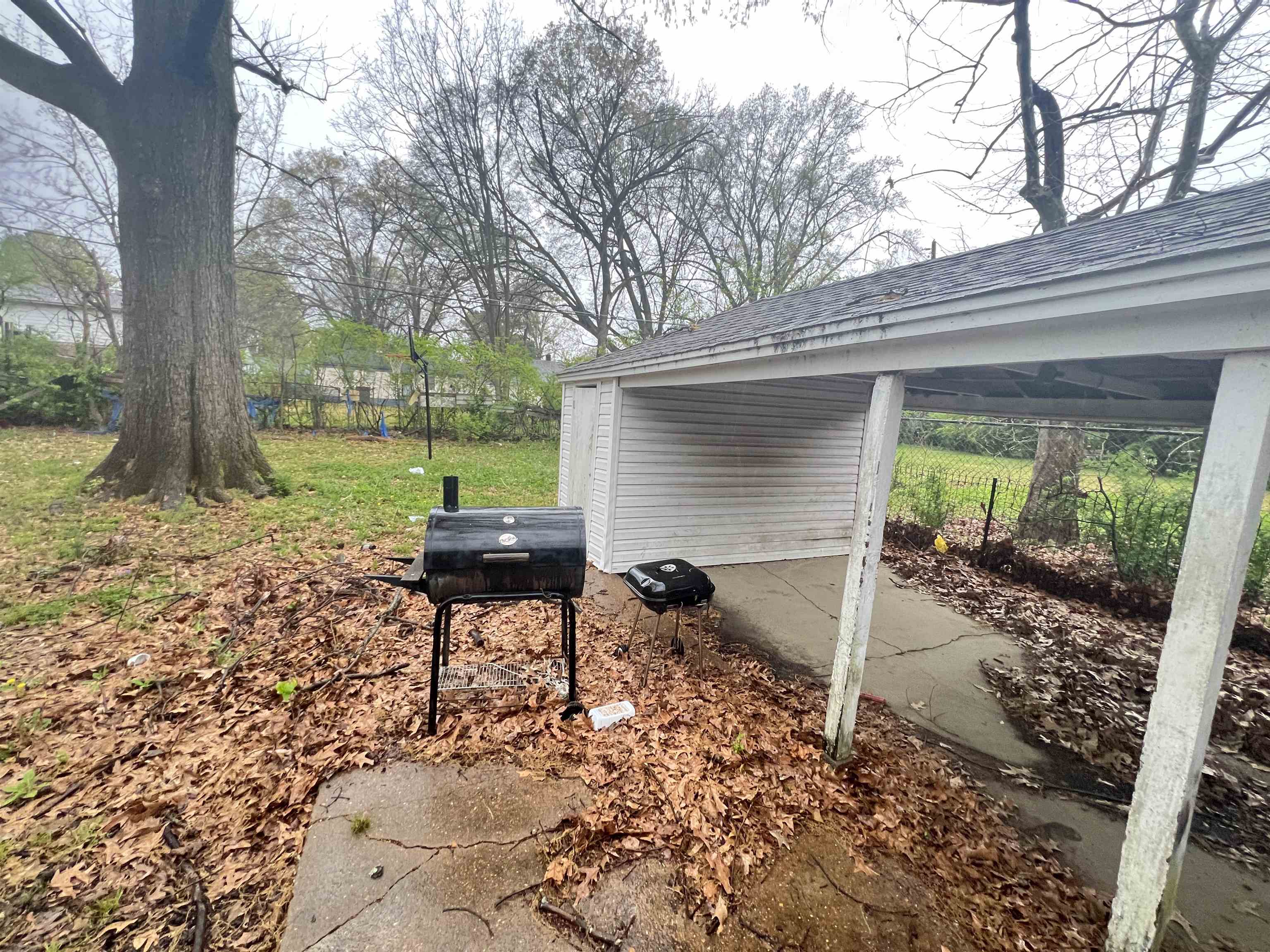 1007 Railton Road Memphis, TN 38111 - Photo 12 of 12 a backyard of a house with table and chairs