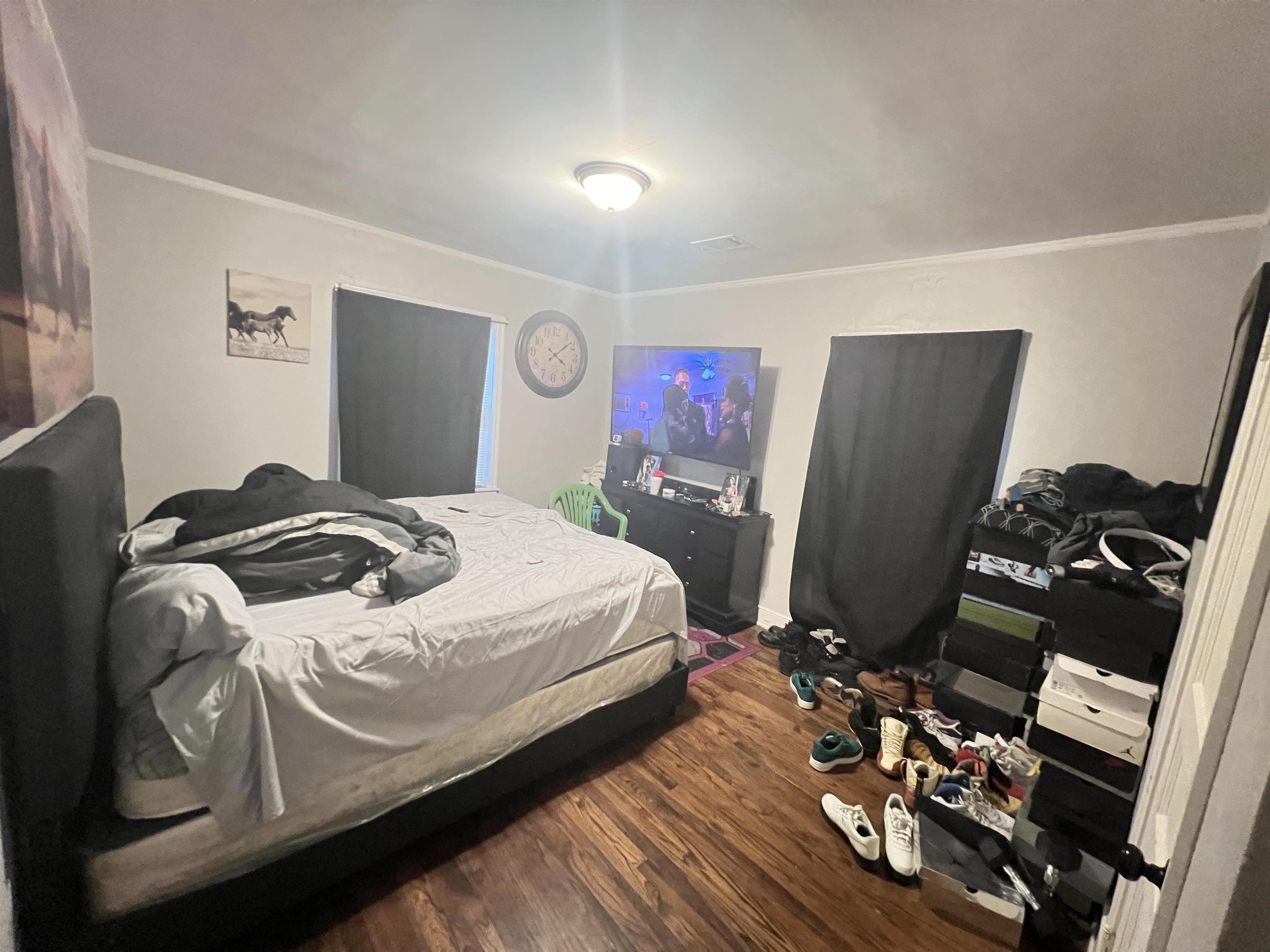 1007 Railton Road Memphis, TN 38111 - Photo 8 of 12 a bedroom with bed and a flat screen tv