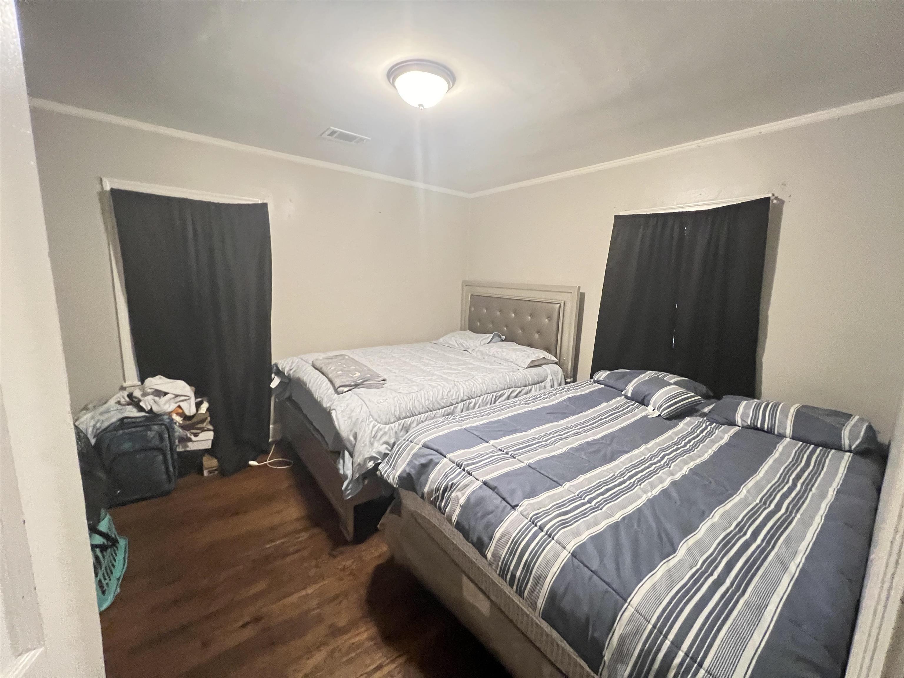 1007 Railton Road Memphis, TN 38111 - Photo 9 of 12 a bedroom with a bed and a dresser