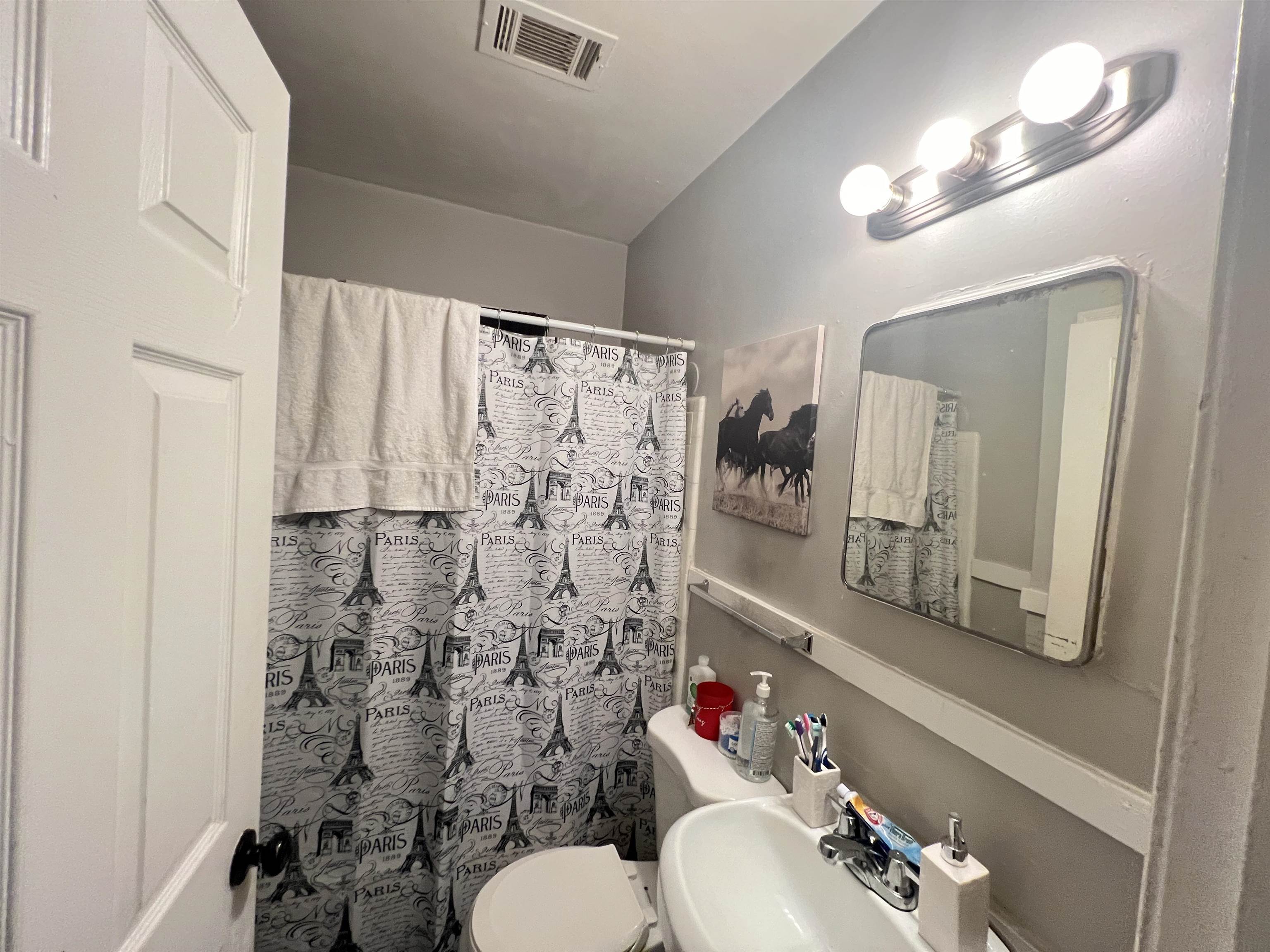 1007 Railton Road Memphis, TN 38111 - Photo 10 of 12 a bathroom with a toilet sink and mirror