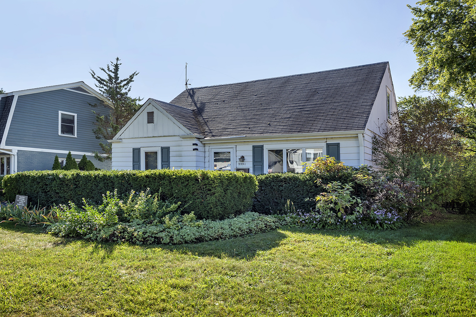 2221 Illinois Road Northbrook, IL 60062 - Photo 2 of 8 a front view of a house with a yard