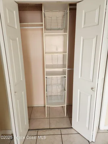 a view of a refrigerator and window in a kitchen