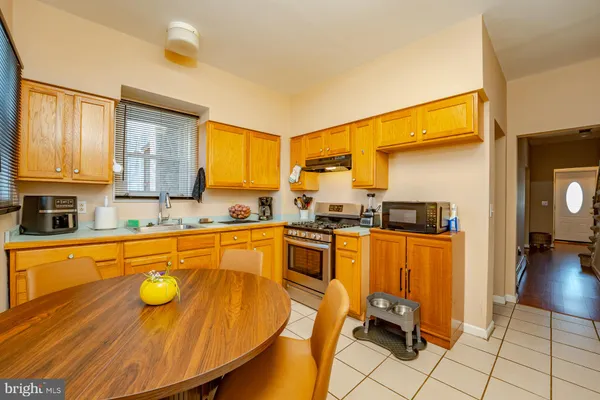 a kitchen with stainless steel appliances granite countertop a sink and cabinets