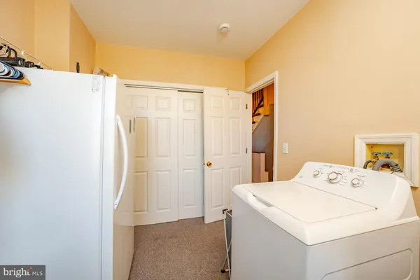 a bathroom with a mirror and shower