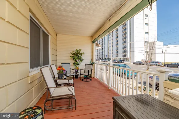 a view of a backyard with wooden fence