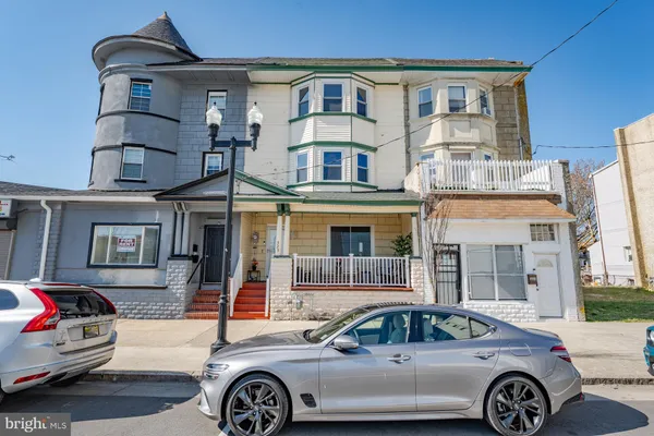 a front view of a house with parking space