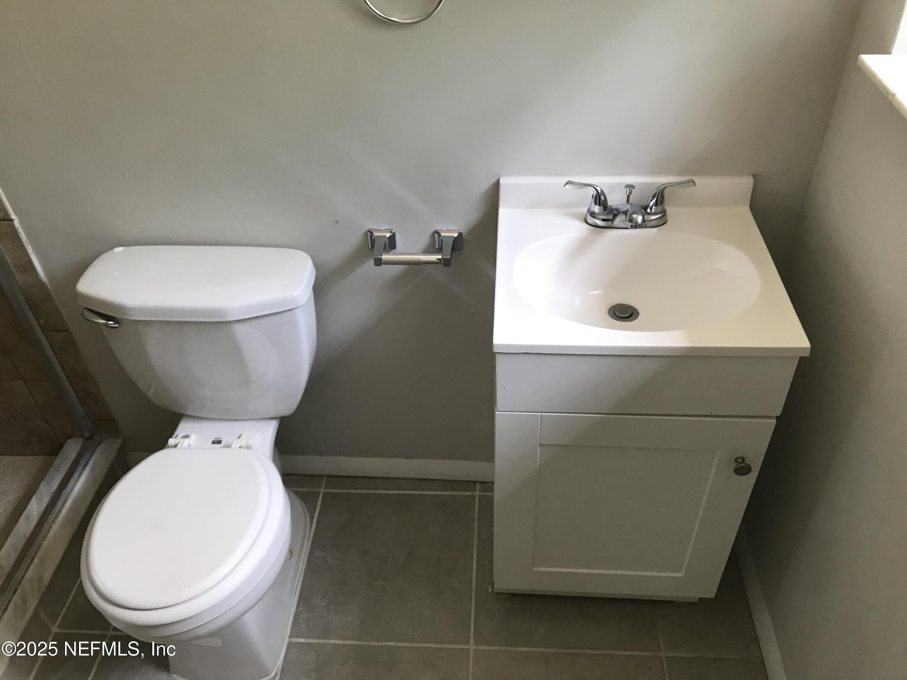 7419 Sandhurst Road South Jacksonville, FL 32277 - Photo 13 of 16 a bathroom with a toilet and a sink