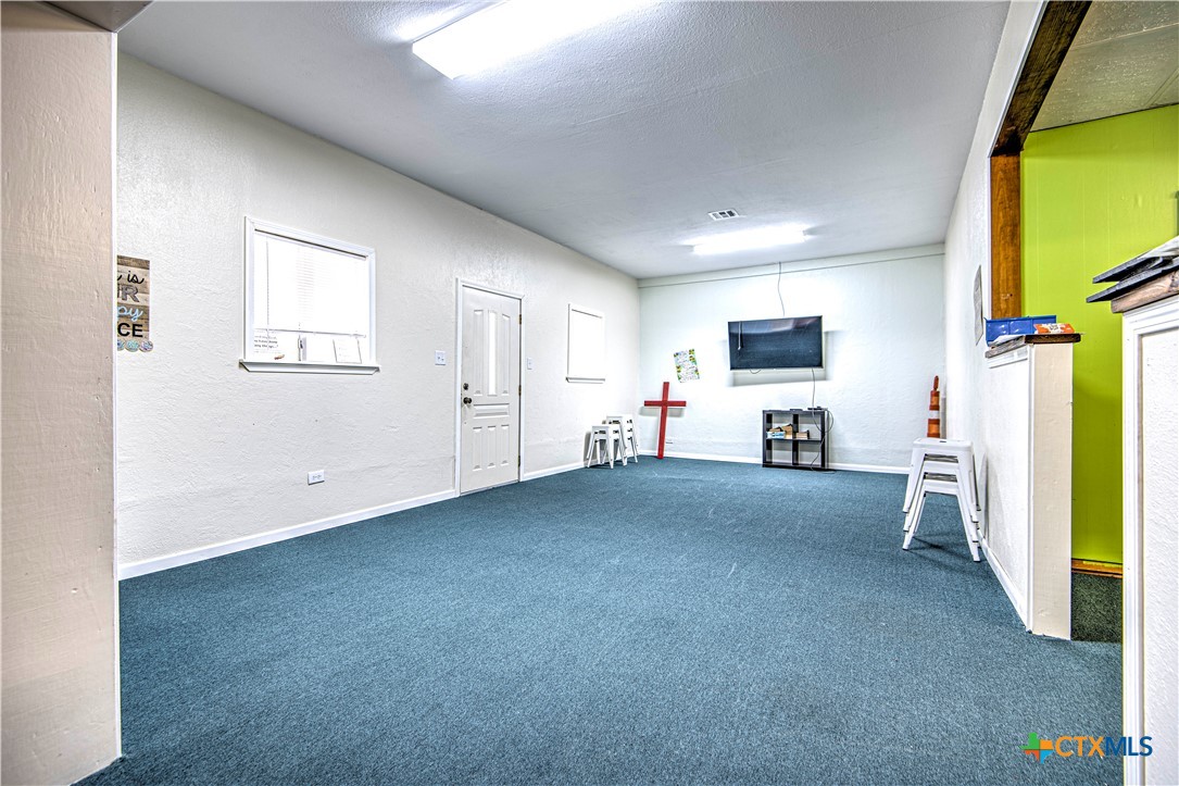 13875 Moffat Road Temple, TX 76502 - Photo 25 of 39 a view of livingroom with furniture and a flat screen tv