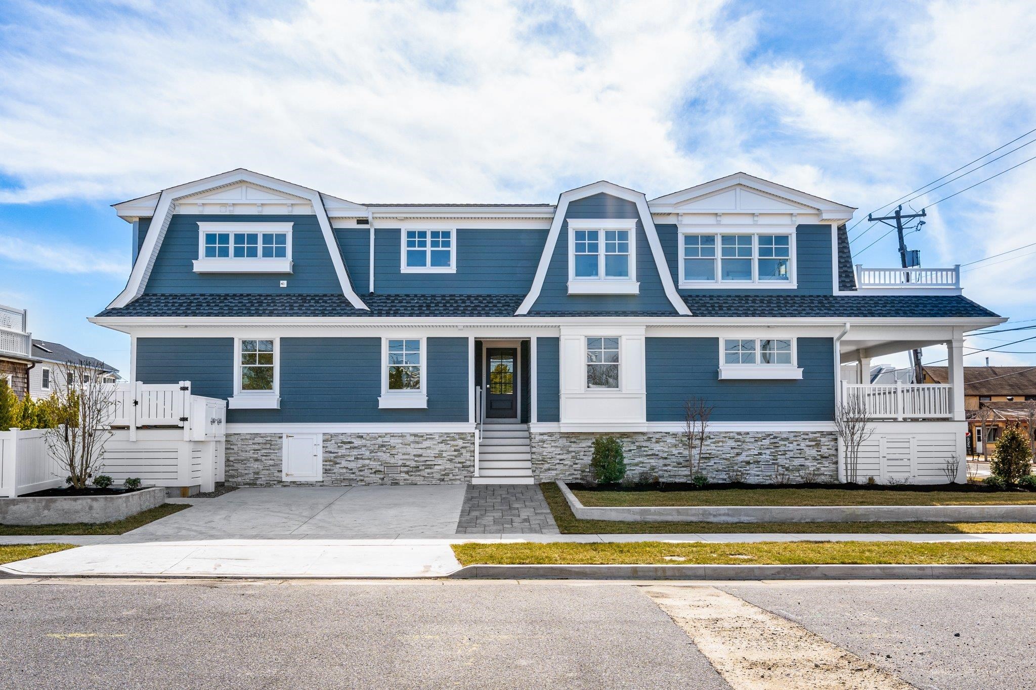 10700 3rd, Unit SOUTH Stone Harbor, NJ 08247 - Photo 1 of 30 a view of a brick house with a large windows