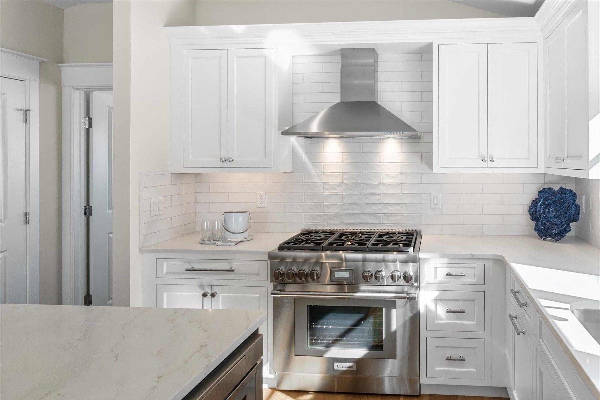 10700 3rd, Unit SOUTH Stone Harbor, NJ 08247 - Photo 12 of 30 a kitchen with granite countertop a stove and a sink