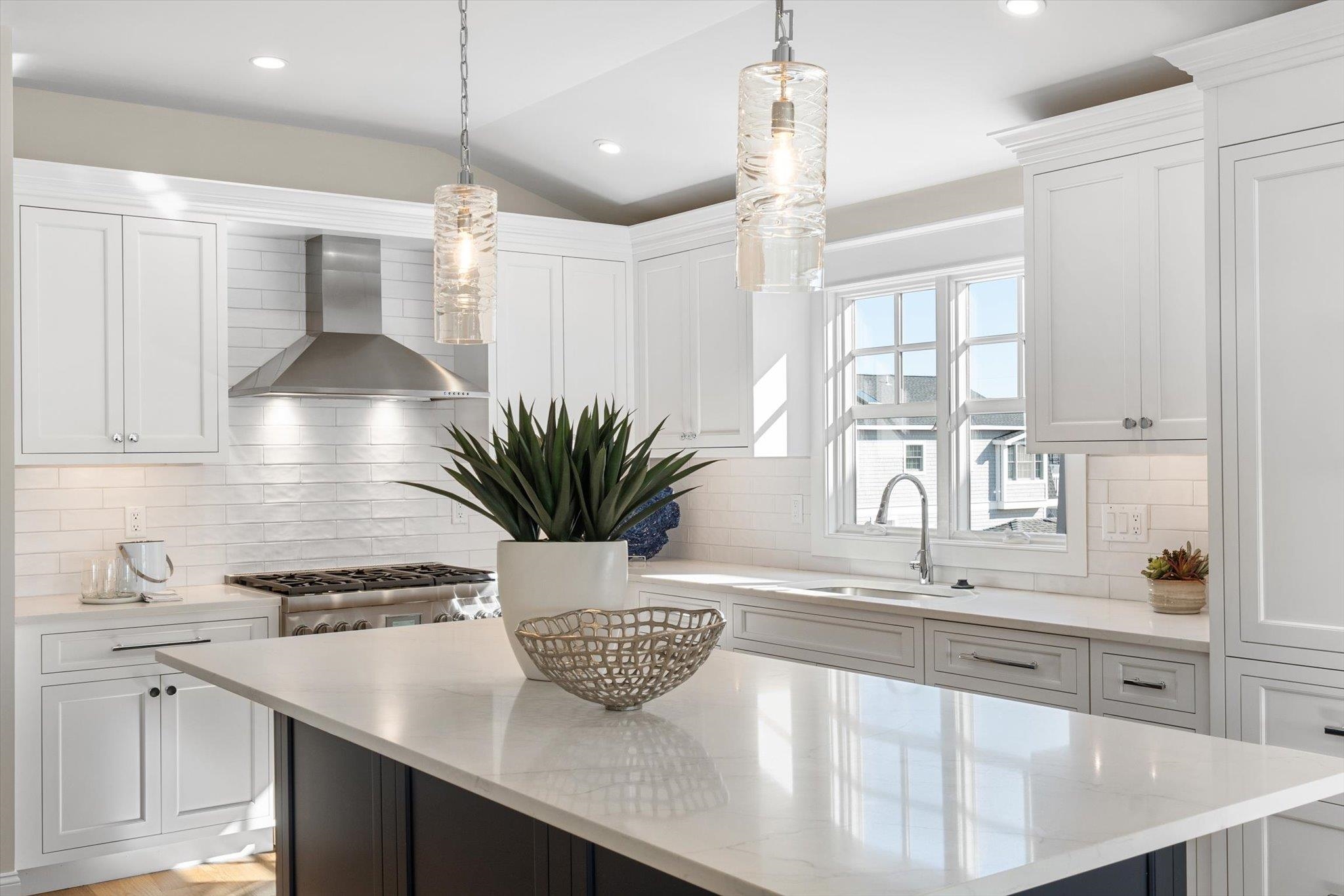 10700 3rd, Unit SOUTH Stone Harbor, NJ 08247 - Photo 13 of 30 a view of a kitchen with kitchen island a counter appliances a sink and a window