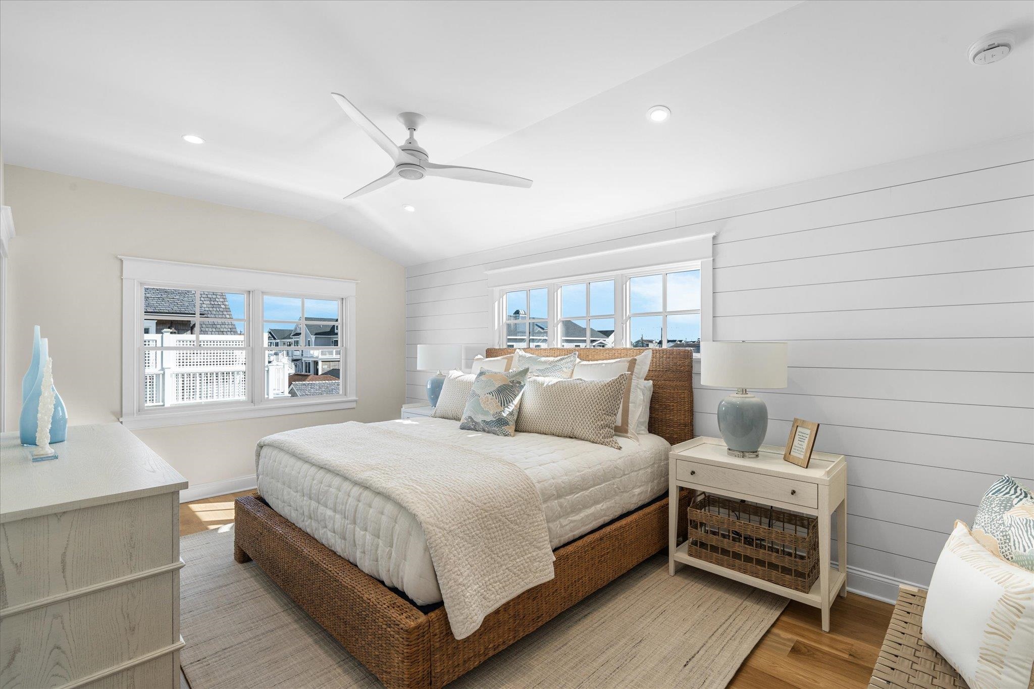 10700 3rd, Unit SOUTH Stone Harbor, NJ 08247 - Photo 18 of 30 a bedroom with a bed and a window