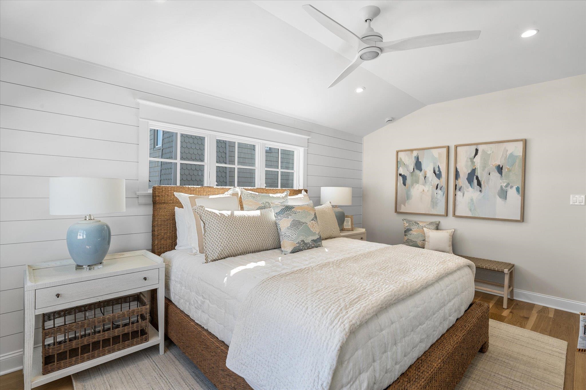 10700 3rd, Unit SOUTH Stone Harbor, NJ 08247 - Photo 19 of 30 a bedroom with a large bed and a chandelier