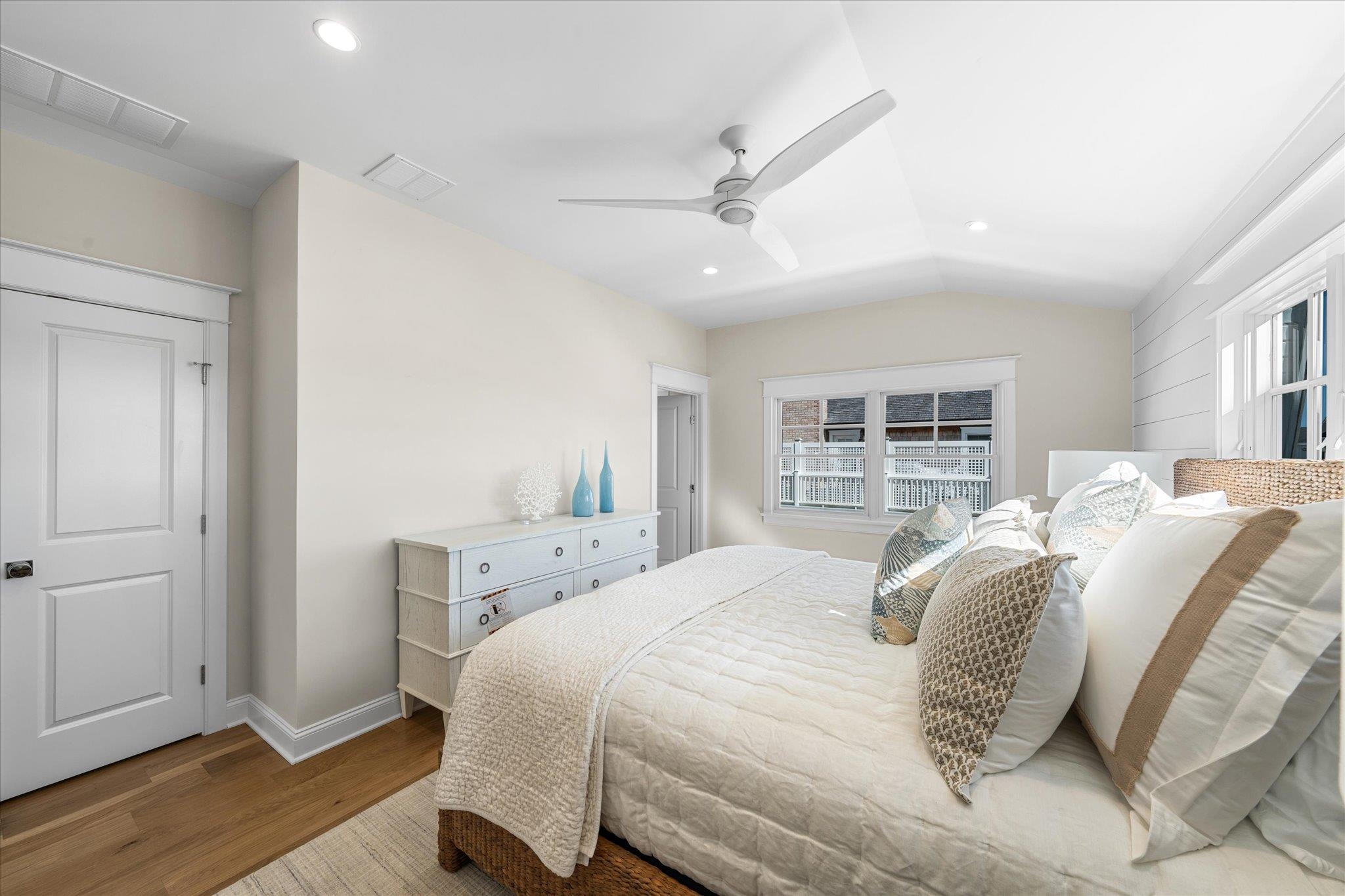 10700 3rd, Unit SOUTH Stone Harbor, NJ 08247 - Photo 20 of 30 a bedroom with a large bed and a window