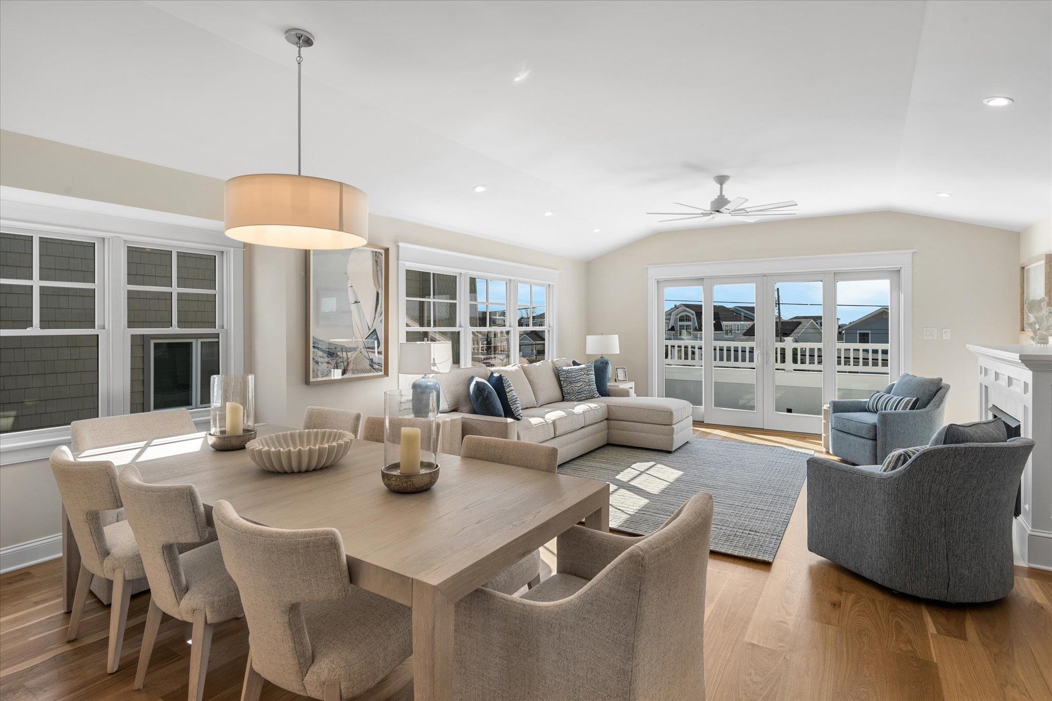 10700 3rd, Unit SOUTH Stone Harbor, NJ 08247 - Photo 3 of 30 a living room with fireplace furniture and a large window