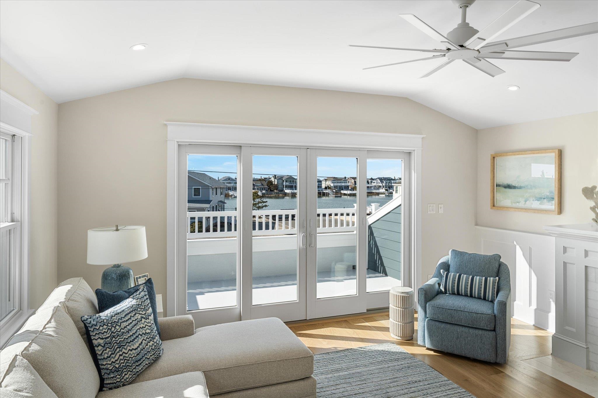 10700 3rd, Unit SOUTH Stone Harbor, NJ 08247 - Photo 6 of 30 a living room with furniture and a floor to ceiling window