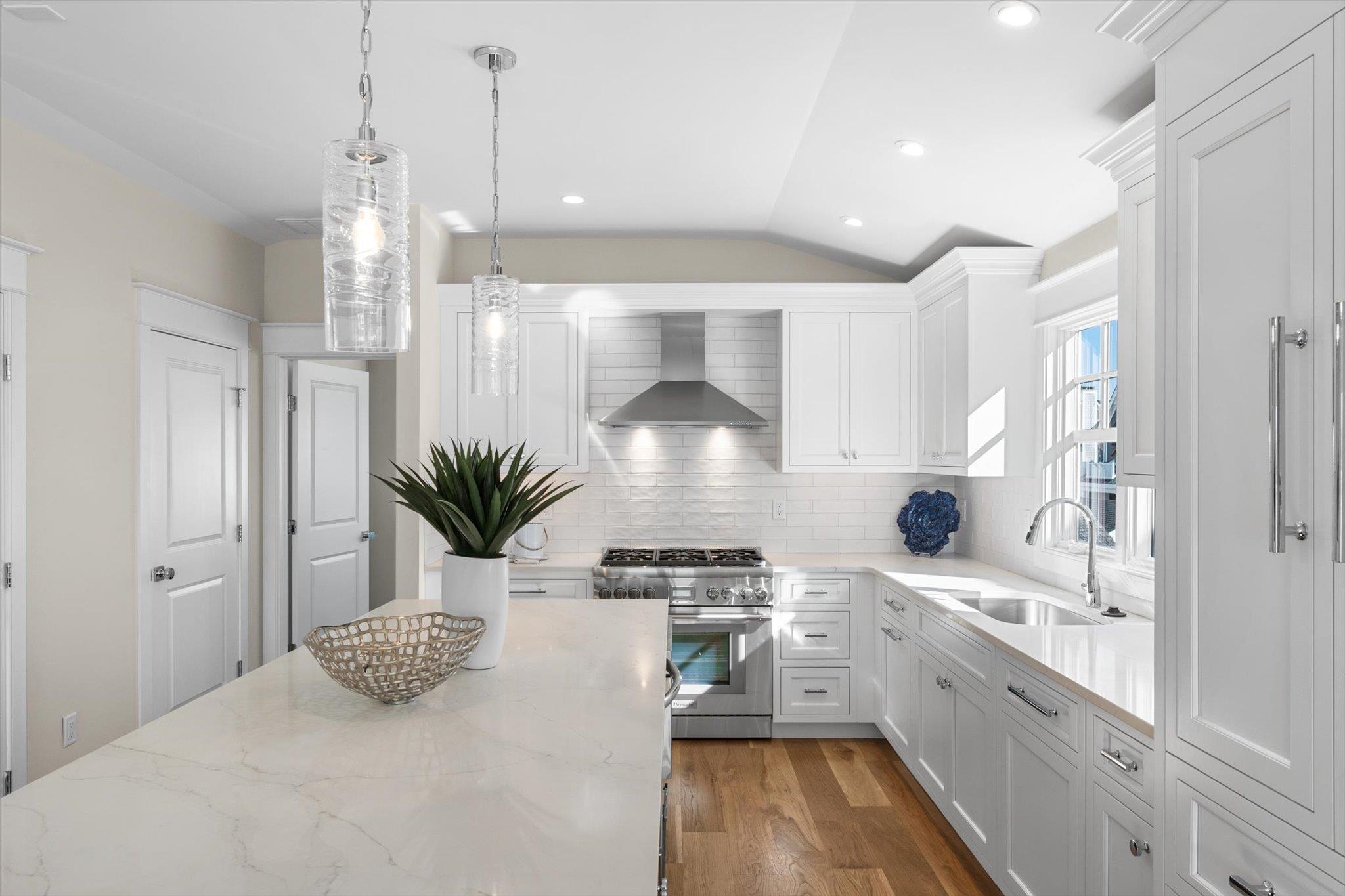 10700 3rd, Unit SOUTH Stone Harbor, NJ 08247 - Photo 10 of 30 a kitchen with stainless steel appliances a refrigerator a sink a stove and white cabinets