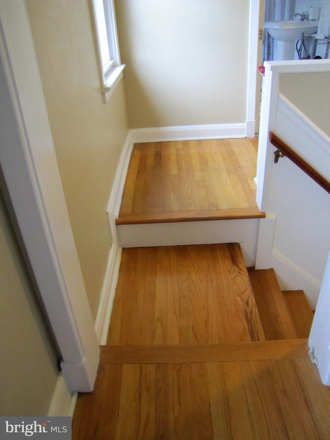 6310 South Orchard Road Linthicum, MD 21090 - Photo 27 of 52 Stairs with beautiful hardwood floors