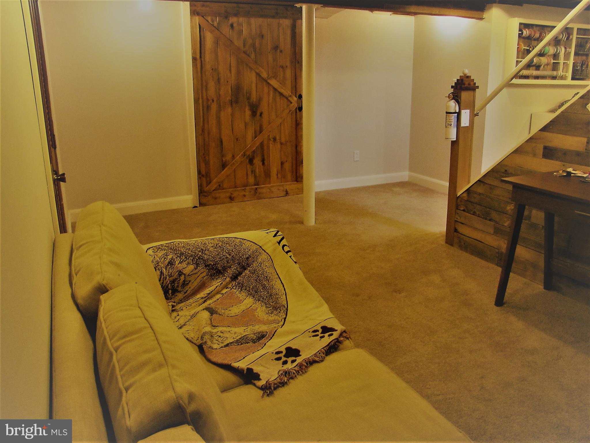 6310 South Orchard Road Linthicum, MD 21090 - Photo 41 of 52 Barn door to unfinished storage room