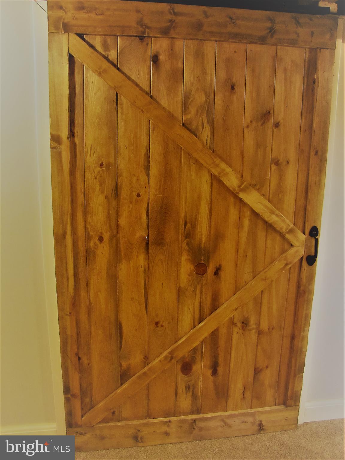 6310 South Orchard Road Linthicum, MD 21090 - Photo 42 of 52 Beautiful hand crafted barn door made by homeowner