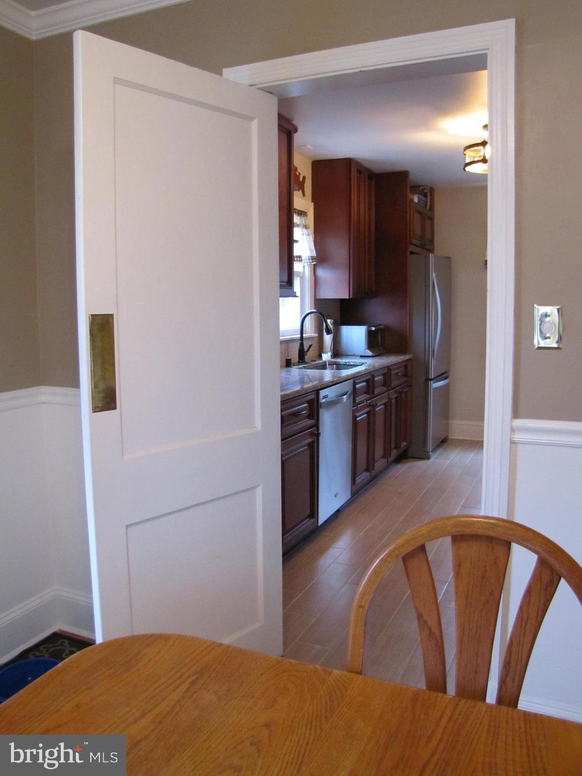 6310 South Orchard Road Linthicum, MD 21090 - Photo 8 of 52 Swing door from dining room to kitchen