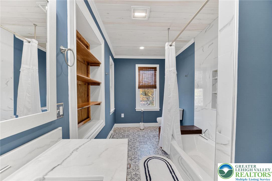 4430 Coplay Creek Road, Unit B Schnecksville, PA 18078 - Photo 11 of 27 a bedroom with a bed dresser and a window