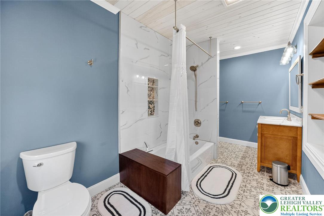 4430 Coplay Creek Road, Unit B Schnecksville, PA 18078 - Photo 12 of 27 a bathroom with a toilet a sink and mirror