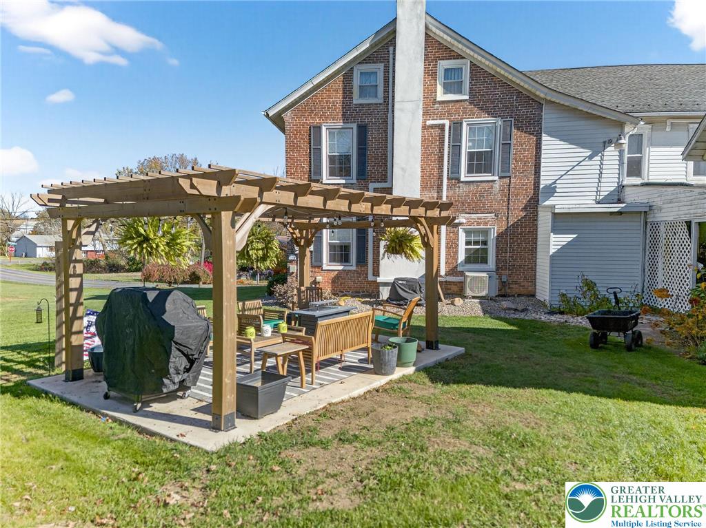 4430 Coplay Creek Road, Unit B Schnecksville, PA 18078 - Photo 2 of 27 a view of a house with backyard sitting area and garden