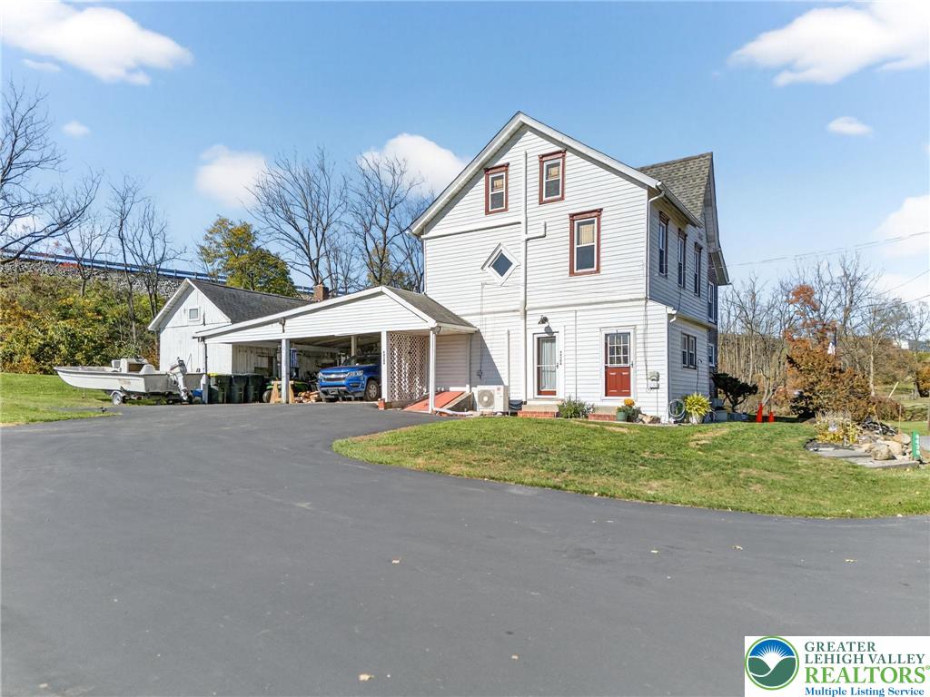 4430 Coplay Creek Road, Unit B Schnecksville, PA 18078 - Photo 27 of 27 a front view of a house with a yard and garage