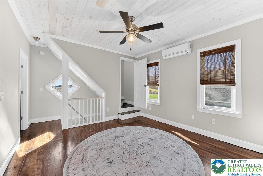4430 Coplay Creek Road, Unit B Schnecksville, PA 18078 - Photo 3 of 27 a view of a livingroom with wooden floor and a ceiling fan