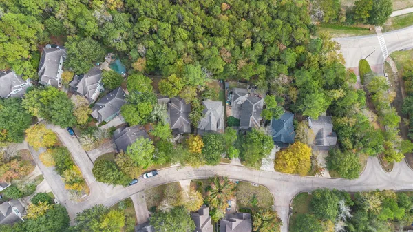 an aerial view of a house with a yard and lake view