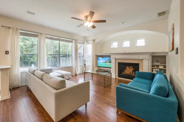 a living room with furniture and a fireplace