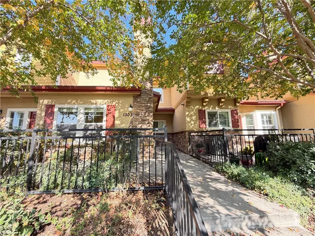 a view of house with outdoor seating and city view