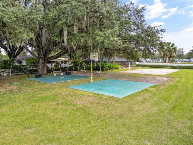 a view of a playground with basketball court