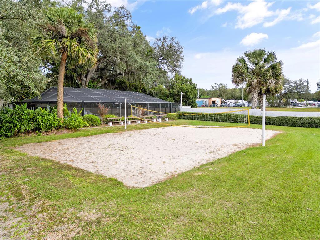 39132 County Road 54, Unit 2180 Zephyrhills, FL 33542 - Photo 13 of 19 a view of yard with swimming pool and green space