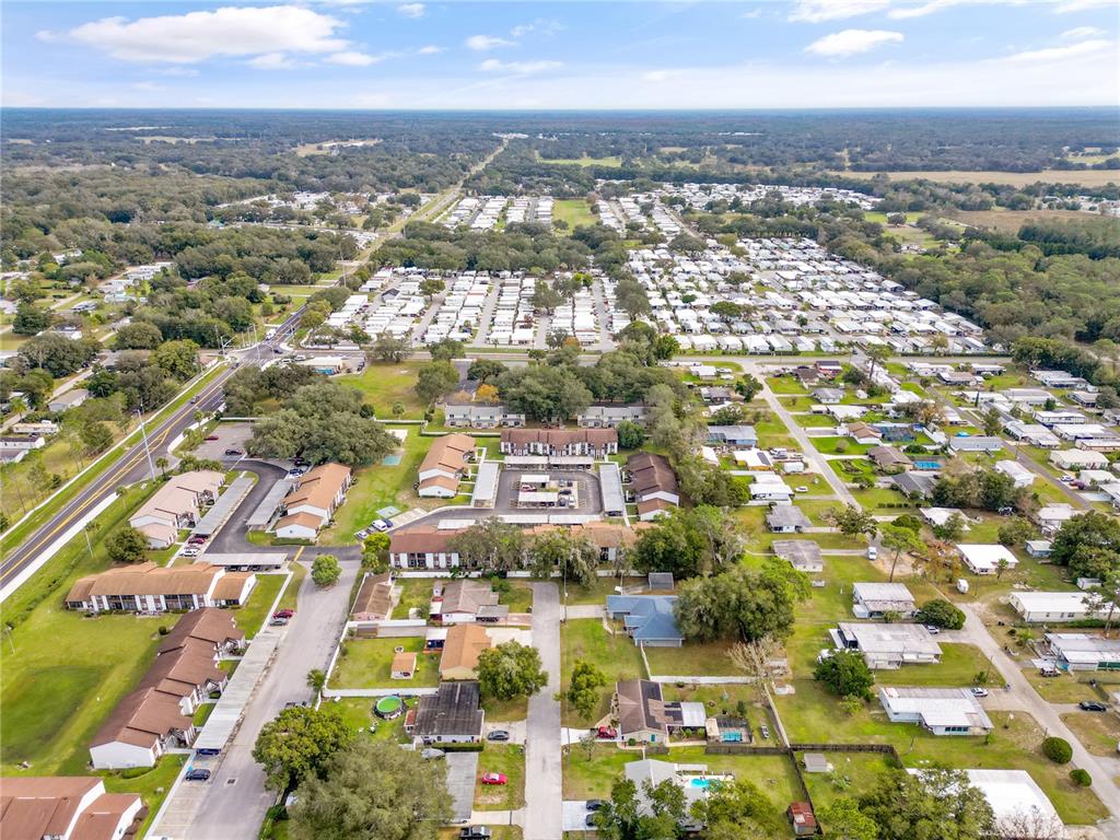 39132 County Road 54, Unit 2180 Zephyrhills, FL 33542 - Photo 15 of 19 an aerial view of residential building with parking