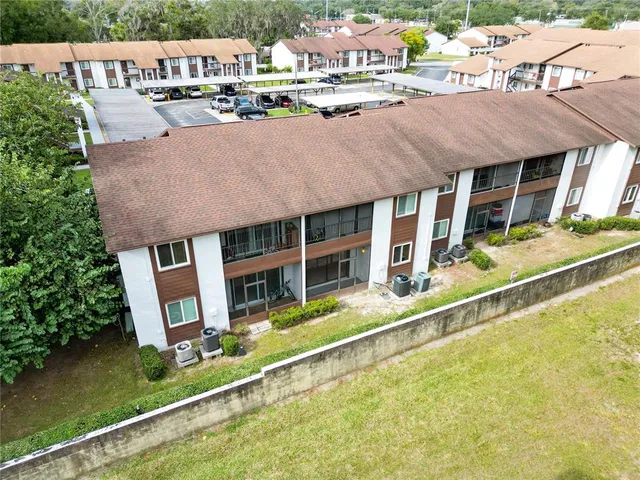 aerial view of a house with swimming pool and sitting area