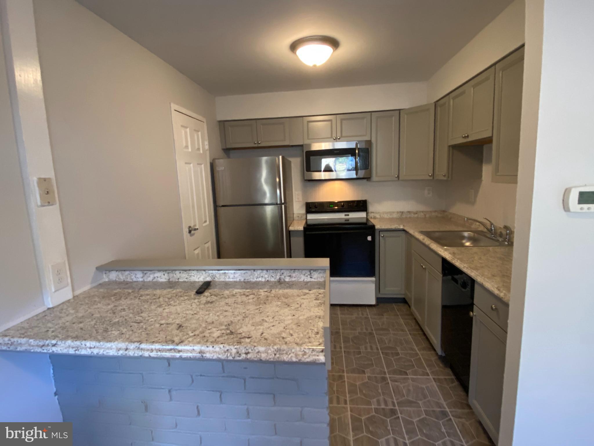 280 Bridgewater Road, Unit B18 Brookhaven, PA 19015 - Photo 11 of 23 Kitchen with large pantry closet