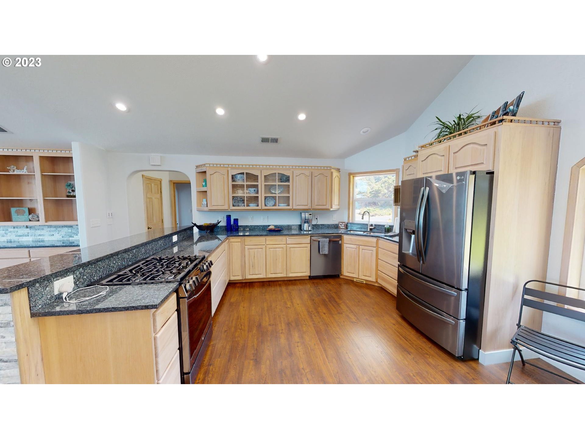 33704 Ophir Road Gold Beach, OR 97444 - Photo 12 of 47 a kitchen with stainless steel appliances granite countertop a refrigerator a stove and a sink