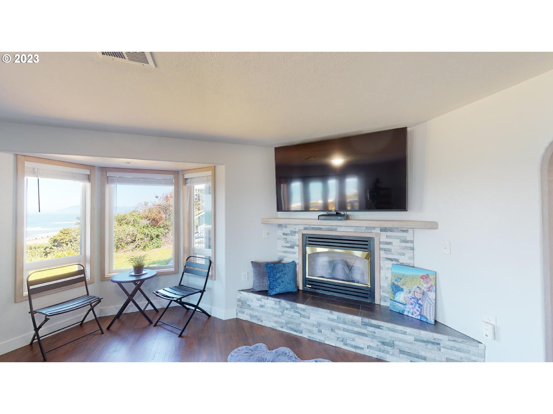 33704 Ophir Road Gold Beach, OR 97444 - Photo 22 of 47 a living room with furniture and a flat screen tv