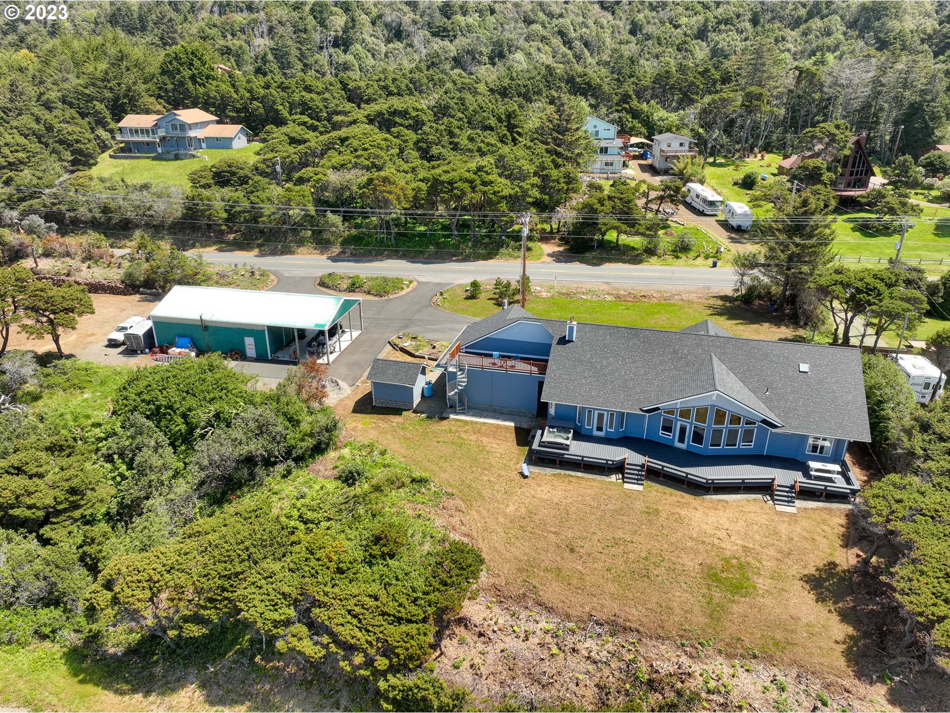 33704 Ophir Road Gold Beach, OR 97444 - Photo 3 of 47 an aerial view of a house with swimming pool and ocean view