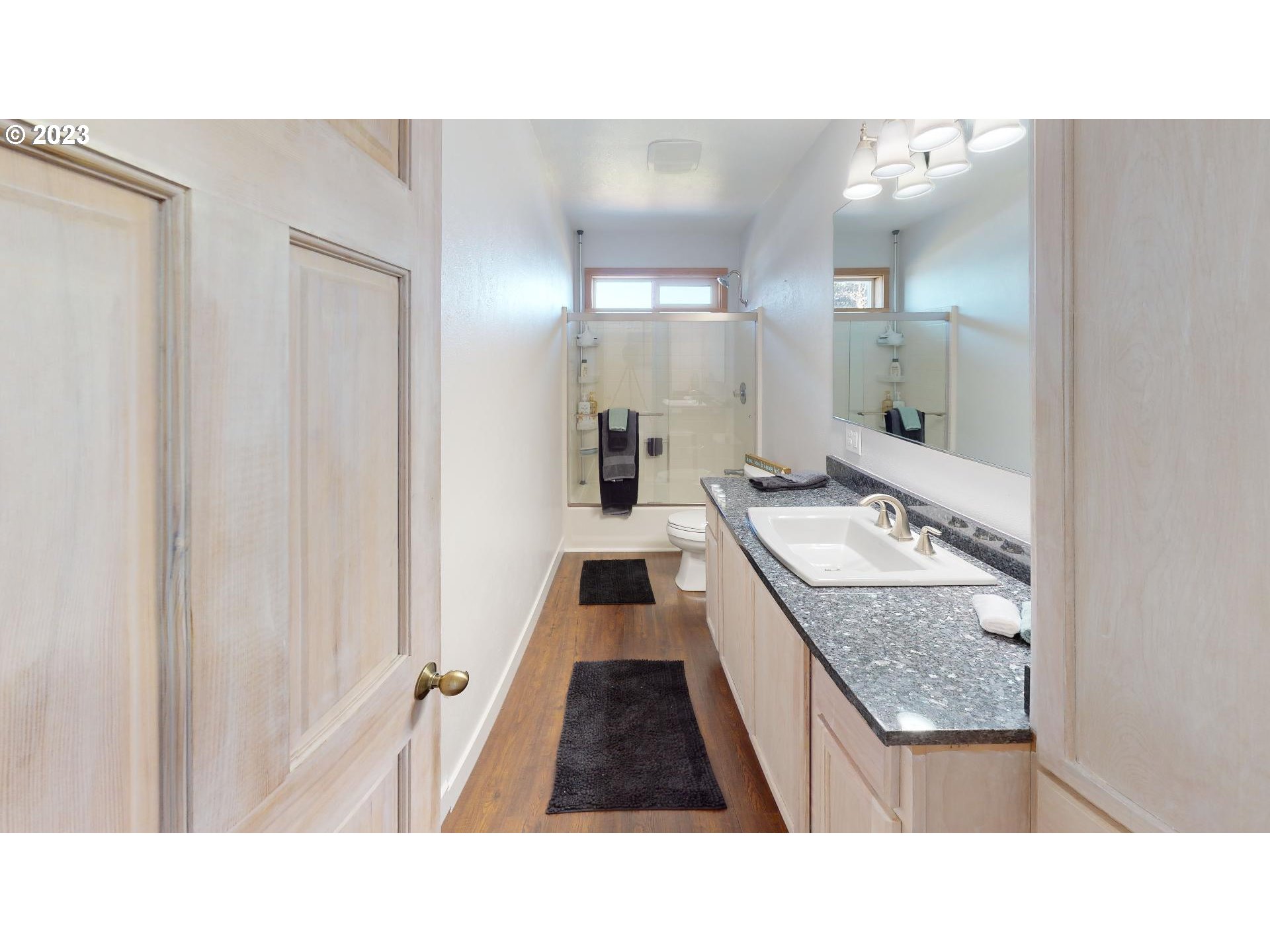 33704 Ophir Road Gold Beach, OR 97444 - Photo 35 of 47 a bathroom with a sink a mirror and a shower